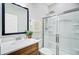 Bathroom with a wooden vanity, large mirror, and a glass-enclosed shower at 596 Dunswell Dr, Summerville, SC 29486