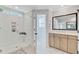 Modern bathroom featuring walk-in shower, large mirror, and neutral tones at 596 Dunswell Dr, Summerville, SC 29486