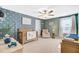 Charming Bedroom with airplane-themed wallpaper, a crib, and a comfortable rocking chair at 596 Dunswell Dr, Summerville, SC 29486