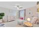 Bright Bedroom with pink accents, a crib, rocking chair, and plenty of natural light at 596 Dunswell Dr, Summerville, SC 29486