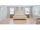 Bright bedroom with light hardwood floors, neutral walls, and abundant natural light at 596 Dunswell Dr, Summerville, SC 29486