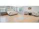 Bright bedroom with light hardwood floors, neutral walls, and large windows for abundant natural light at 596 Dunswell Dr, Summerville, SC 29486