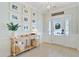 Charming foyer with natural light, decor, hardwood floors, and a welcoming ambiance for guests at 596 Dunswell Dr, Summerville, SC 29486