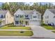 Charming two-story home featuring a manicured lawn, inviting porch, and a two-car garage in a Gathering-friendly neighborhood at 596 Dunswell Dr, Summerville, SC 29486
