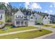 Beautiful two-story home with lush lawn and landscaping, featuring a welcoming front porch and attached two-car garage at 596 Dunswell Dr, Summerville, SC 29486