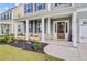Inviting front porch with decorative plants, stylish door, and charming details creating a warm and welcoming entrance at 596 Dunswell Dr, Summerville, SC 29486