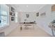 Bright home office with natural light, ample workspace, decor, and hardwood floors, ideal for remote work or study at 596 Dunswell Dr, Summerville, SC 29486