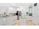 Modern kitchen with white cabinets, stainless steel appliances, and a center island for ample workspace at 596 Dunswell Dr, Summerville, SC 29486