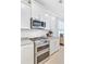 Modern kitchen featuring stainless steel appliances, granite countertops, and white cabinetry at 596 Dunswell Dr, Summerville, SC 29486