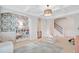Spacious playroom with decorative wallpaper and a charming archway leading to other areas of the home at 596 Dunswell Dr, Summerville, SC 29486