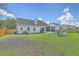 Wide-open backyard featuring a privacy fence, generous lawn space, and patio at 6179 Fieldstone Cir, Charleston, SC 29414