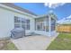Home's backyard with a grill on the patio and a screened-in porch at 6179 Fieldstone Cir, Charleston, SC 29414