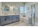 Beautiful bathroom features double sinks, stylish cabinets, and a separate tub and shower at 6179 Fieldstone Cir, Charleston, SC 29414