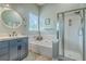 Well-lit bathroom features a soaking tub and walk-in glass shower at 6179 Fieldstone Cir, Charleston, SC 29414