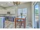 Bright eat-in kitchen area with natural light and stainless steel appliances at 6179 Fieldstone Cir, Charleston, SC 29414
