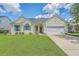 Charming single-story home with a well-manicured lawn, a two-car garage, and decorative green shutters at 6179 Fieldstone Cir, Charleston, SC 29414