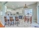 Bright kitchen with stainless appliances, a dining area and breakfast bar with seating at 6179 Fieldstone Cir, Charleston, SC 29414