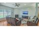 Comfortable living room features a fireplace, ceiling fan, and relaxing leather seating at 6179 Fieldstone Cir, Charleston, SC 29414
