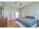 Large main bedroom with natural light, ceiling fan, and hardwood floors at 6179 Fieldstone Cir, Charleston, SC 29414