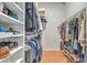 Spacious walk-in closet with ample hanging space and shelves for organized storage at 6179 Fieldstone Cir, Charleston, SC 29414