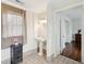Bathroom with tiled floors and a pedestal sink, offering a view into another room at 66 Beaufain St, Charleston, SC 29401