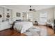 Bedroom with hardwood floors, large windows, and built-in bookshelves at 66 Beaufain St, Charleston, SC 29401
