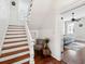 Bright stairway entrance that leads to a bedroom at 66 Beaufain St, Charleston, SC 29401