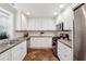 Bright kitchen with modern white cabinets, stainless steel appliances, and tile floors at 66 Beaufain St, Charleston, SC 29401