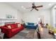 Spacious living room and dining area featuring two couches, table, and ceiling fan at 66 Beaufain St, Charleston, SC 29401