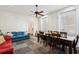 Spacious living and dining area featuring a large table and blue couch at 66 Beaufain St, Charleston, SC 29401