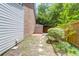 Wide shot of backyard including storage shed, brick, and concrete pavers at 680 Buckhall Ct, Mount Pleasant, SC 29464
