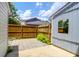 Fenced-in backyard features a stone paver patio and fern plants at 680 Buckhall Ct, Mount Pleasant, SC 29464