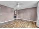 A spacious bedroom features wood-look floors and access to ensuite bathroom at 680 Buckhall Ct, Mount Pleasant, SC 29464