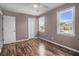 A bright bedroom features wood-look floors, ceiling fan and multiple closets at 680 Buckhall Ct, Mount Pleasant, SC 29464