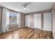 Bedroom with wood-look floors, a ceiling fan, natural light, and closet space at 680 Buckhall Ct, Mount Pleasant, SC 29464