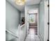 Upstairs hallway with painted walls, white trim, and tile floors leading to a bedroom at 680 Buckhall Ct, Mount Pleasant, SC 29464