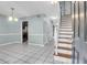 Open living area with tile flooring and staircase at 680 Buckhall Ct, Mount Pleasant, SC 29464