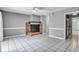 Living room with brick fireplace, white tiled floors, and neutral paint at 680 Buckhall Ct, Mount Pleasant, SC 29464