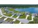 Beautiful aerial view of waterfront homes with well-maintained lawns and landscaping near a serene lake at 682 Pontoon Rd, Huger, SC 29450