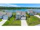 Expansive aerial view of a pristine lake with well-maintained homes and lush landscaping at 682 Pontoon Rd, Huger, SC 29450