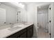 Clean bathroom with double sink vanity, quartz countertop and a neutral-toned shower at 682 Pontoon Rd, Huger, SC 29450