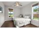 Bedroom featuring twin beds, hardwood floors and bright natural lighting with views of the water at 682 Pontoon Rd, Huger, SC 29450