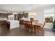 Open concept dining and kitchen area with modern finishes and natural light at 682 Pontoon Rd, Huger, SC 29450