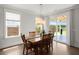 Dining room features natural light, modern lighting, and sliding glass doors to the patio at 682 Pontoon Rd, Huger, SC 29450