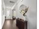 Elegant entryway with hardwood floors, stylish decor, and ample natural light at 682 Pontoon Rd, Huger, SC 29450