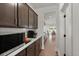 Hallway view with modern cabinets and a clear sightline to the dining and waterfront at 682 Pontoon Rd, Huger, SC 29450