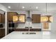 Bright kitchen featuring an island sink, modern lighting, and stainless steel appliances at 682 Pontoon Rd, Huger, SC 29450