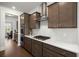 Modern kitchen features stainless steel appliances, range hood, and wood cabinets at 682 Pontoon Rd, Huger, SC 29450
