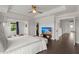 The main bedroom features a ceiling fan, sitting area and doorway to closet at 682 Pontoon Rd, Huger, SC 29450