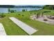 Community recreation area featuring bocce ball court, playground, dog park, and swings at 682 Pontoon Rd, Huger, SC 29450